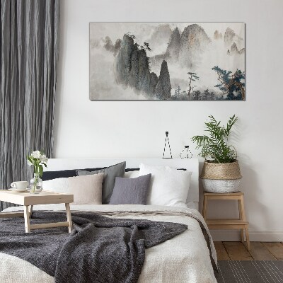 Foto op glas Berglandschap in een mistig landschap