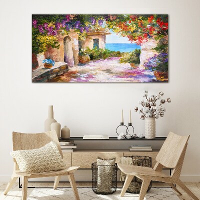 Foto op glas De bloemenlaan van een kustdorp