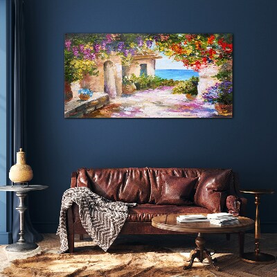 Foto op glas De bloemenlaan van een kustdorp