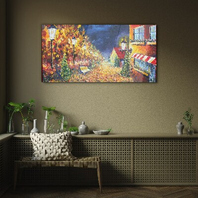 Foto op glas Gouden laan in het schijnsel van lantaarns