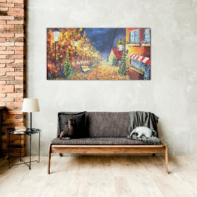 Foto op glas Gouden laan in het schijnsel van lantaarns