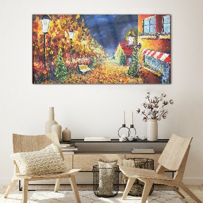 Foto op glas Gouden laan in het schijnsel van lantaarns