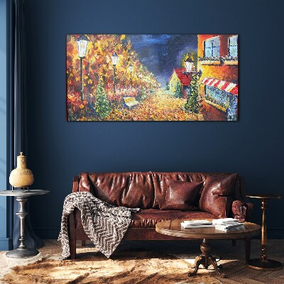 Foto op glas Gouden laan in het schijnsel van lantaarns