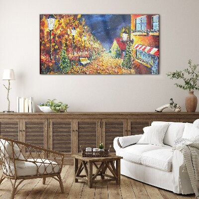 Foto op glas Gouden laan in het schijnsel van lantaarns