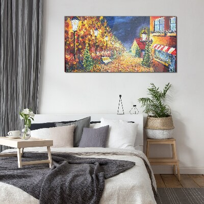 Foto op glas Gouden laan in het schijnsel van lantaarns