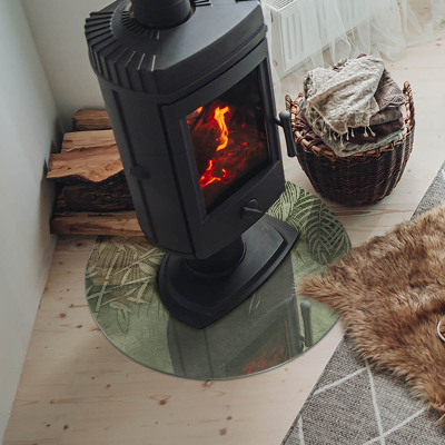 Onderplaat kachel ronde Tropische bladeren op de achtergrond