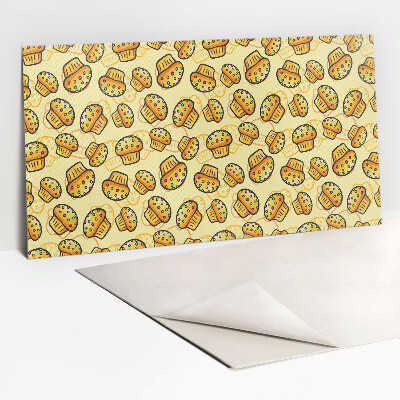 Zelfklevend muurpaneel Kleurrijke cupcakes op een gele achtergrond