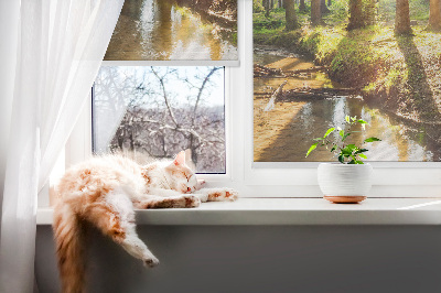 Rolgordijn verduisterend De zon schijnt door de bomen
