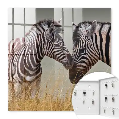 Zebra's bij elkaar op een beige achtergrond