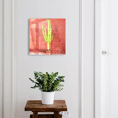 Groene cactus op een rode muur