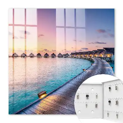 Een vredige zonsondergang met huizen op het water