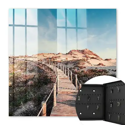 Duinenpad onder een blauwe lucht