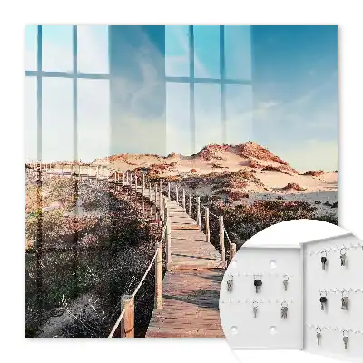 Duinenpad onder een blauwe lucht