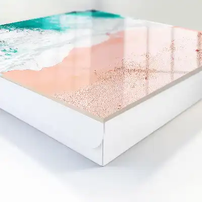 Oceaan en roze zandstrand