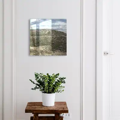 Groene heuvels met een blauwe lucht