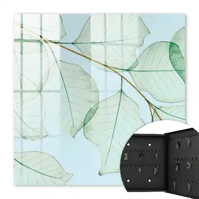 Wanddecoratie met groene bladeren op een pastelkleurige achtergrond