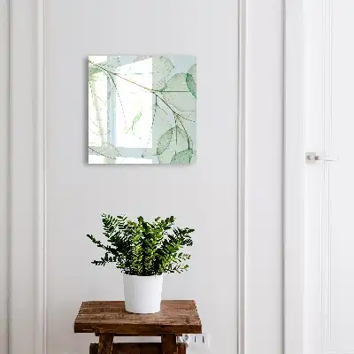 Wanddecoratie met groene bladeren op een pastelkleurige achtergrond