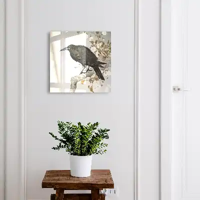 Zwarte raaf op een tak met bloemen