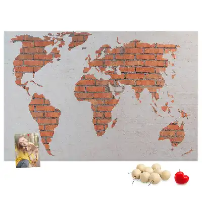 Memobord van kurk Continenten op bakstenen achtergrond
