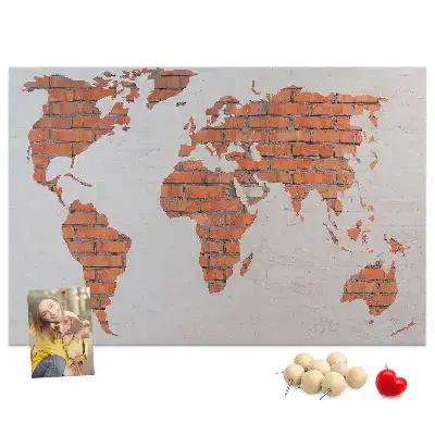 Memobord van kurk Continenten op bakstenen achtergrond